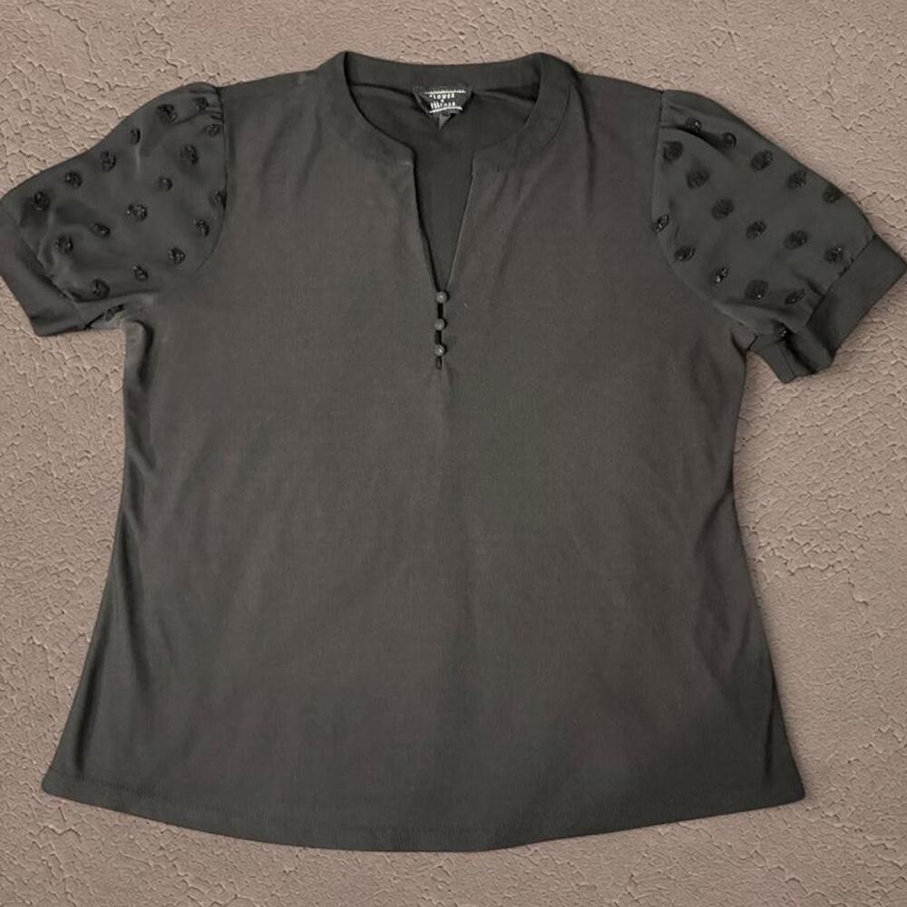 Black blouse with sheer polka dot puff sleeves